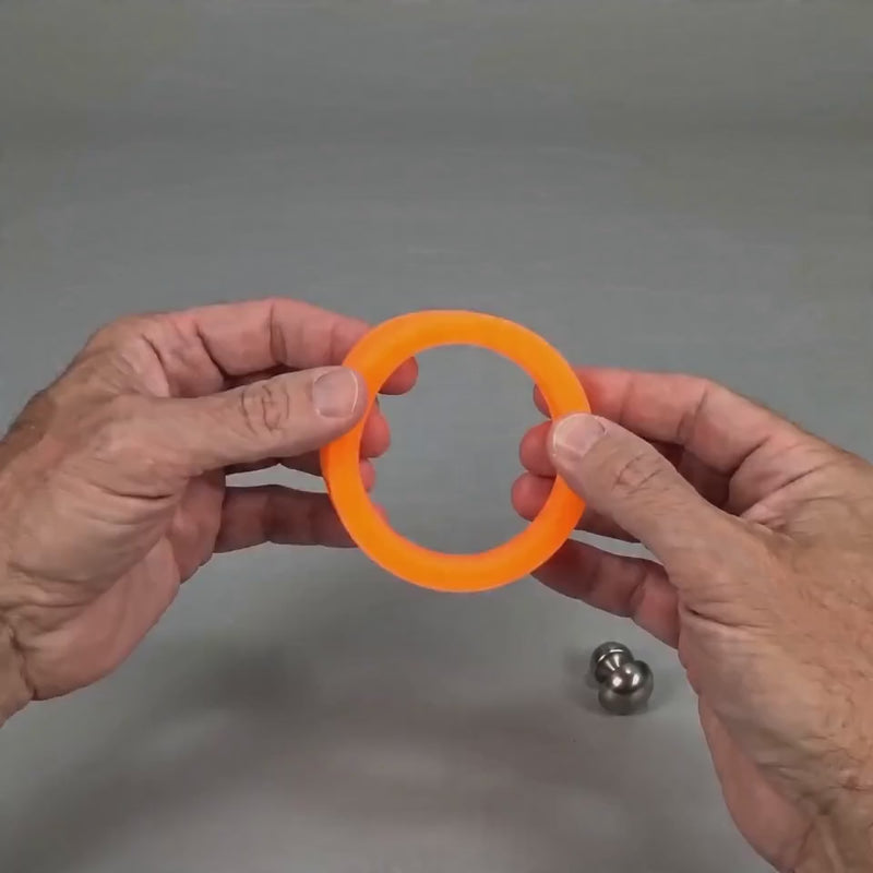 The band is hand poured to be extremely flexible.  Up to 3 attachments can be added or removed to customize the size and feel.